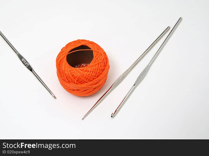 An orange skein of cotton thread