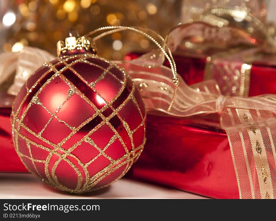 Close up on Christmas ball and red gifts