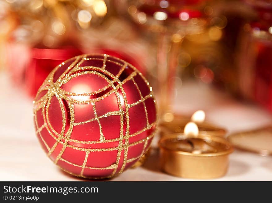 Close up on Christmas ball and red gifts