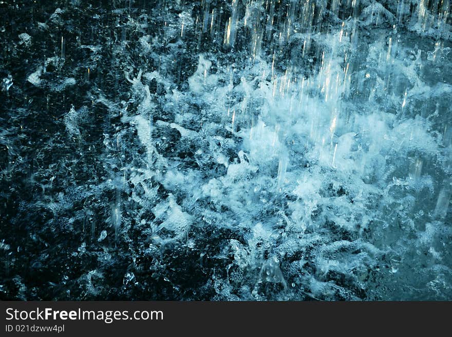 Water splashes from a public fountain.