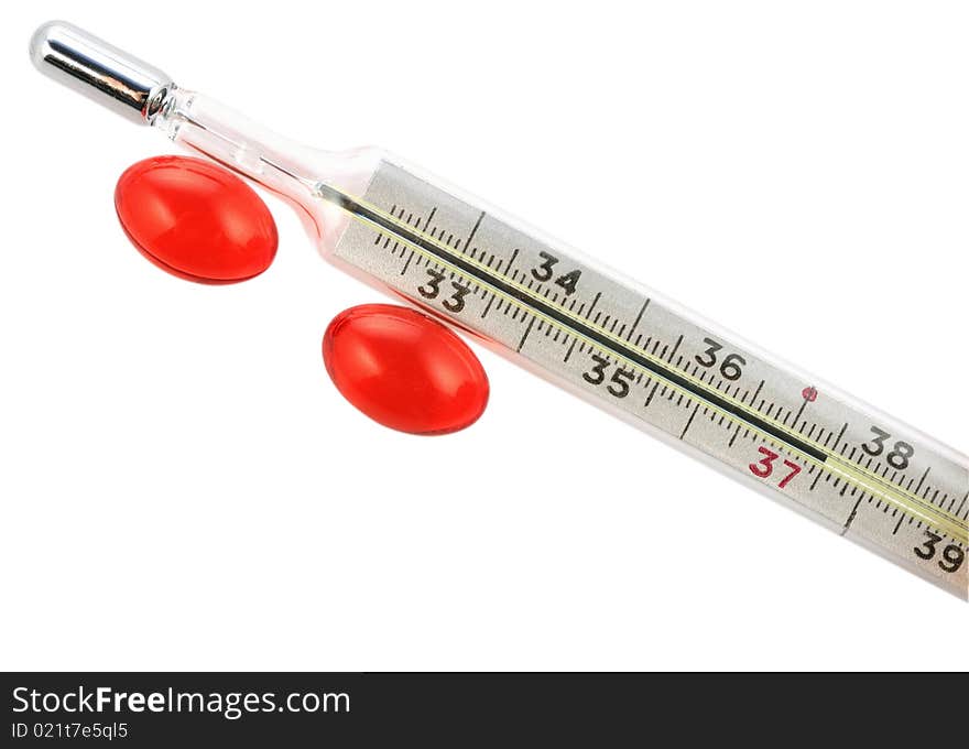 Thermometer with 37,5 degrees and two red capsules. Thermometer with 37,5 degrees and two red capsules