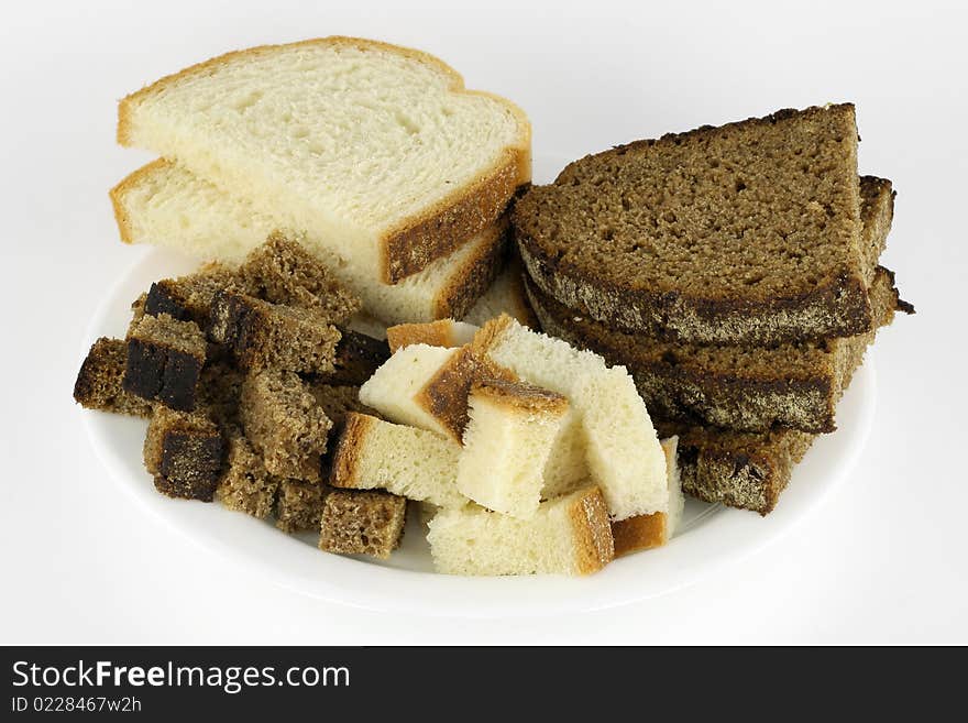 Slices of black rye and white white bread are prepared for to fry in oil. Slices of black rye and white white bread are prepared for to fry in oil.