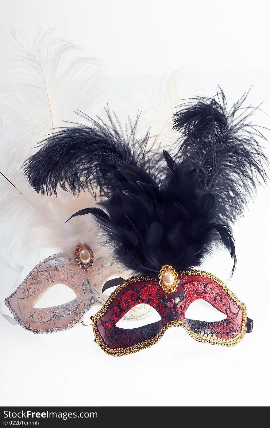 Elegant black and white venetian masks isolated on white. Elegant black and white venetian masks isolated on white