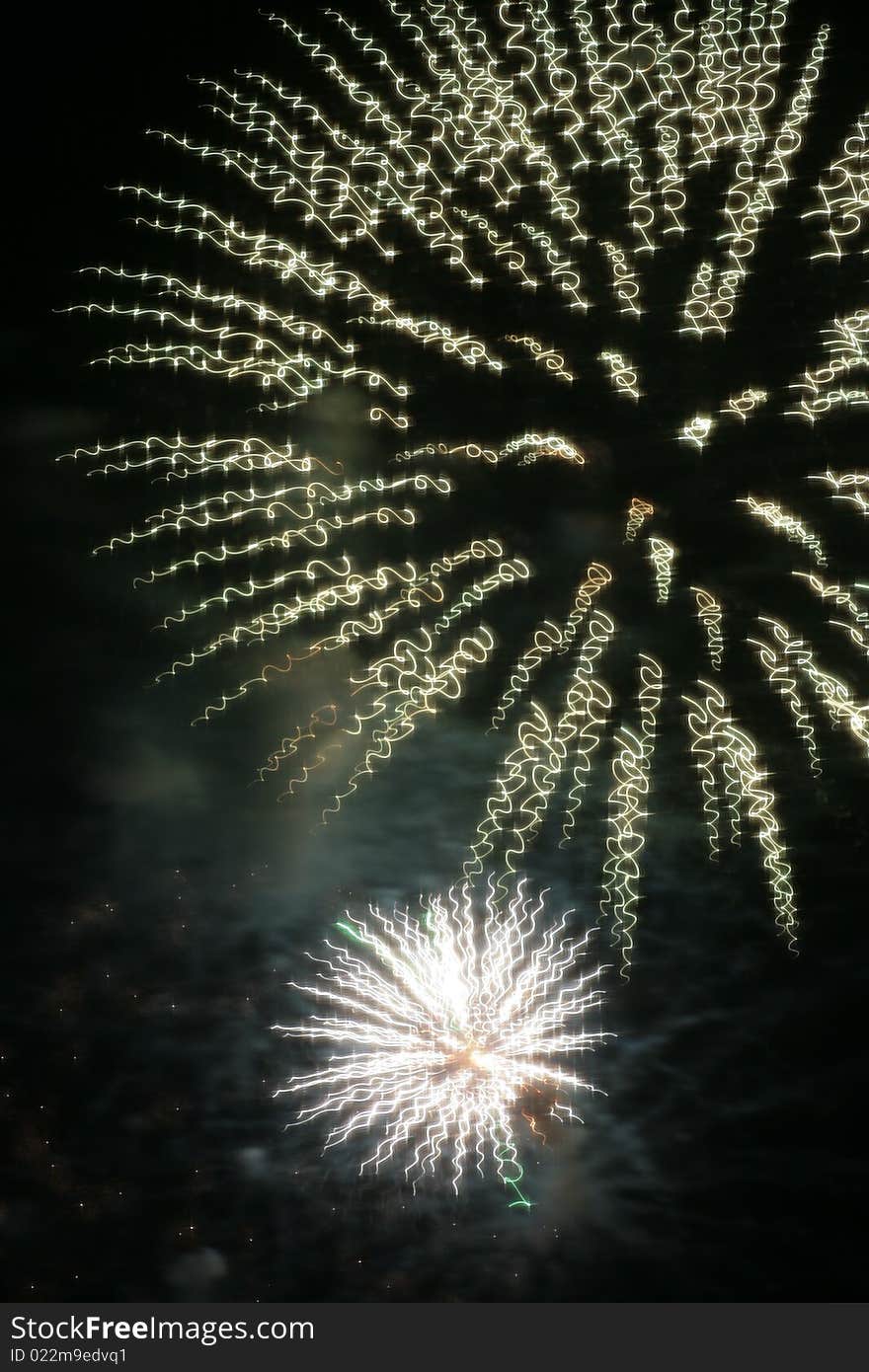 A long-exposure photo of fireworks. A long-exposure photo of fireworks.