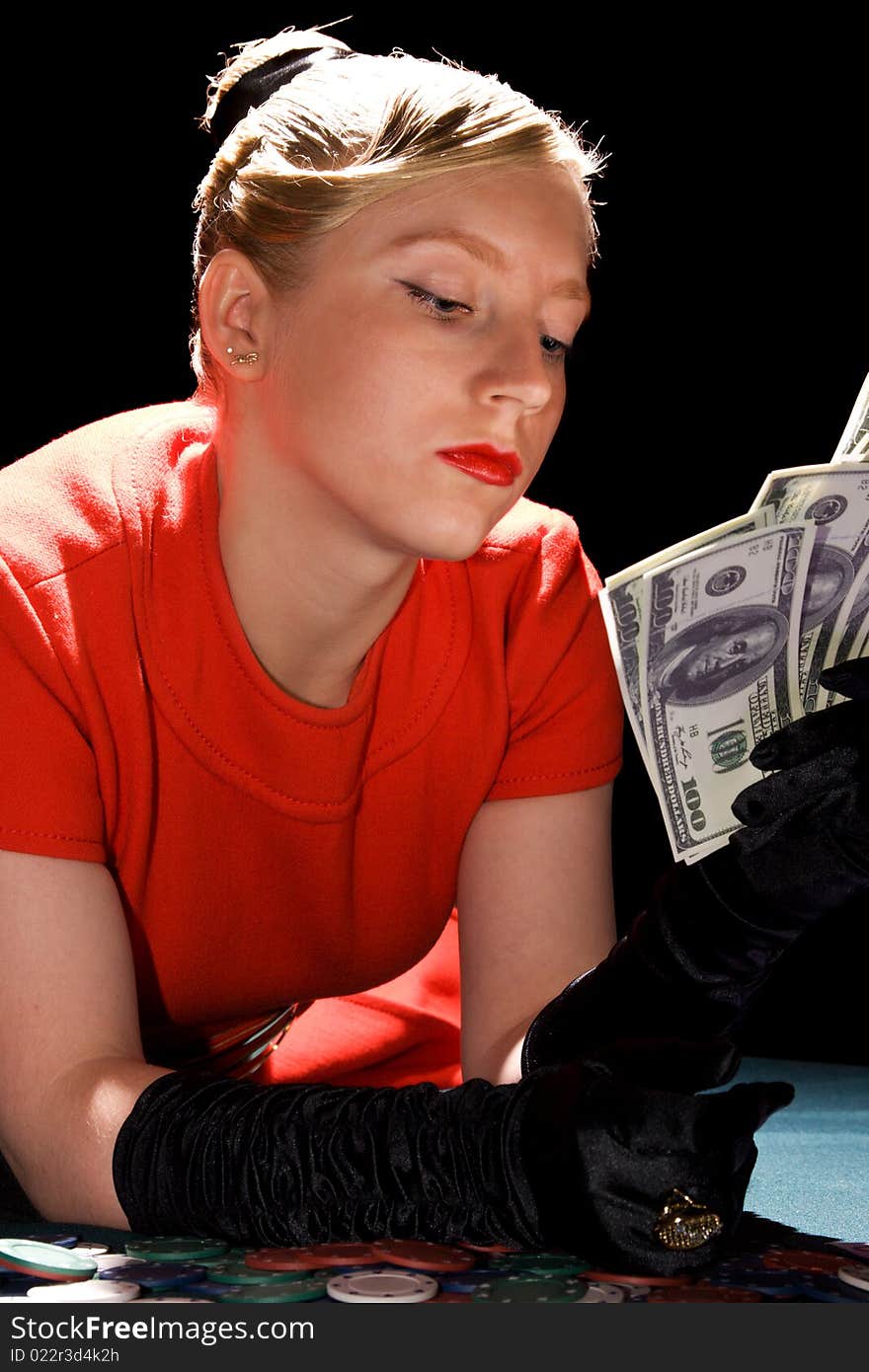 Blond girl holding large sum of dollar cash. Blond girl holding large sum of dollar cash