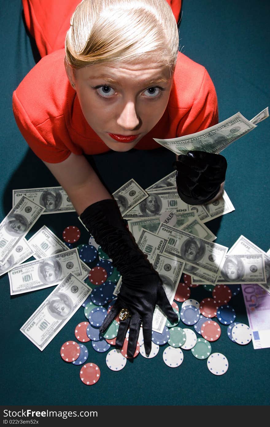 Blond girl holding a large sum of dollar cash. Blond girl holding a large sum of dollar cash