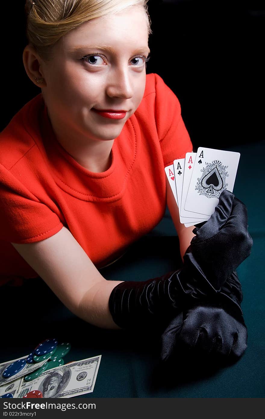 Young smiling woman holds playing cards. Young smiling woman holds playing cards