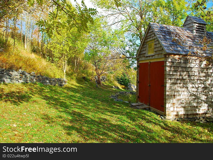 A building or shed on the side of a hill in the wooded countryside, Brighouse, Newfoundland, Canada. A building or shed on the side of a hill in the wooded countryside, Brighouse, Newfoundland, Canada