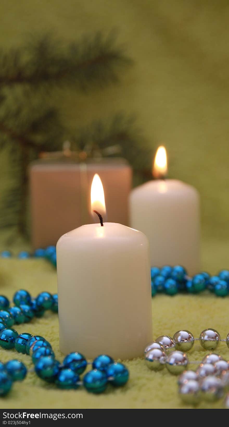 Christmas candles and glassbead on green background. Christmas candles and glassbead on green background