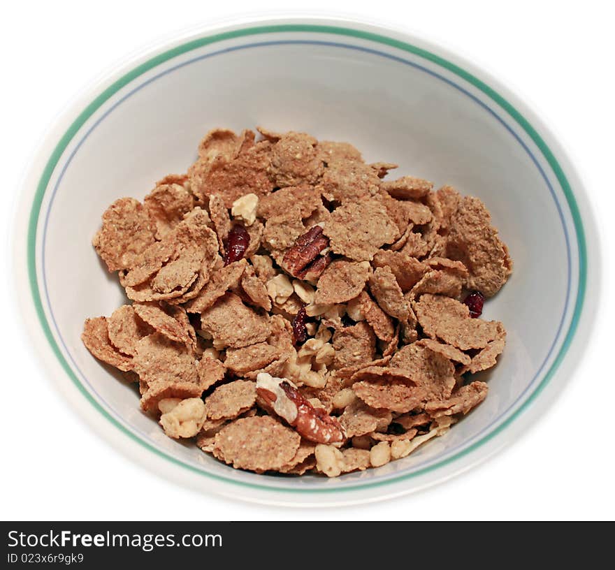 Single serving of multi-grain breakfast cereal with nuts in a bowl. Single serving of multi-grain breakfast cereal with nuts in a bowl