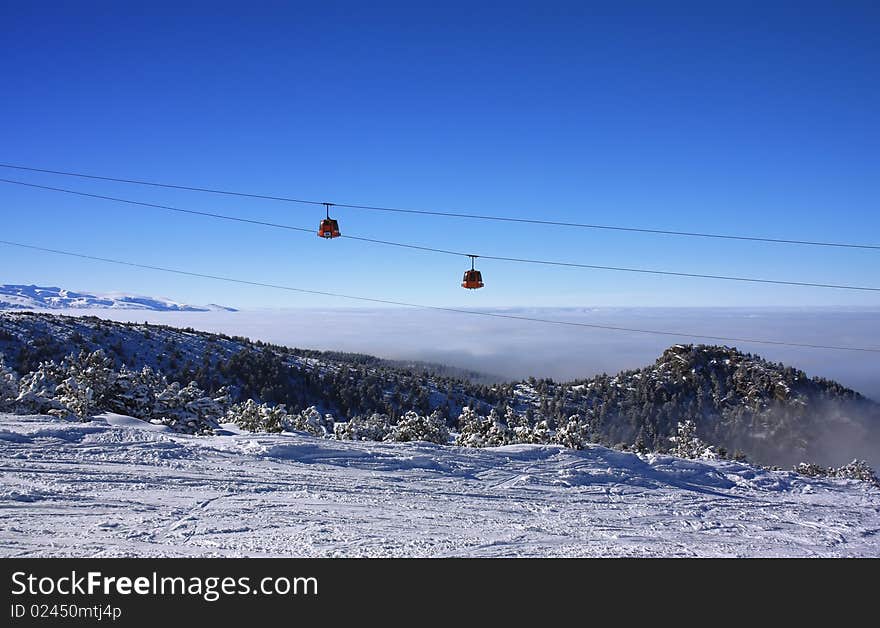 Cable car over mountain landscape. Rila mountains, ski resort Borovets, Bulgaria. Cable car over mountain landscape. Rila mountains, ski resort Borovets, Bulgaria