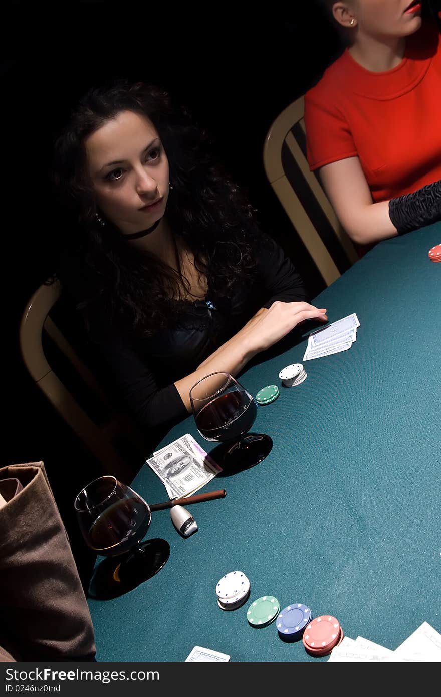 Attractive girls playing poker