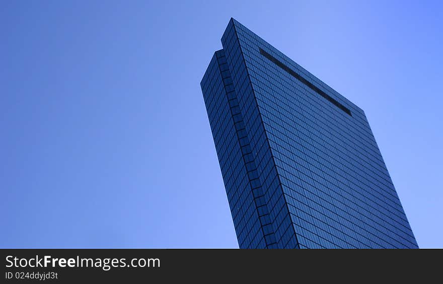 Wide angle view of John Hancock tower with blue sky background, Boston, Massachusetts, U.S.A.