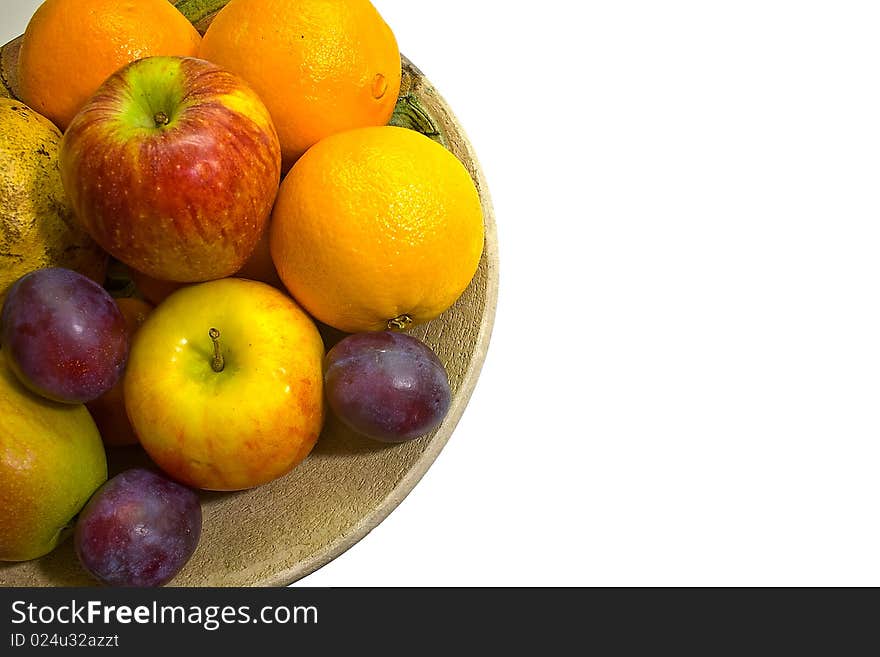 A half dish of fruits with nice white background