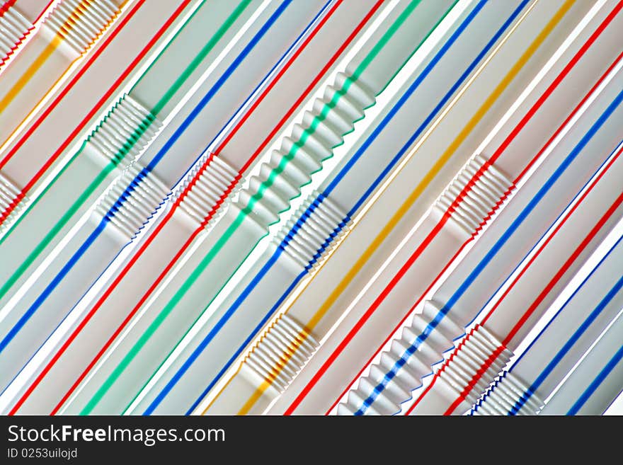 The goffered multi-coloured straws for soft drinks. The goffered multi-coloured straws for soft drinks