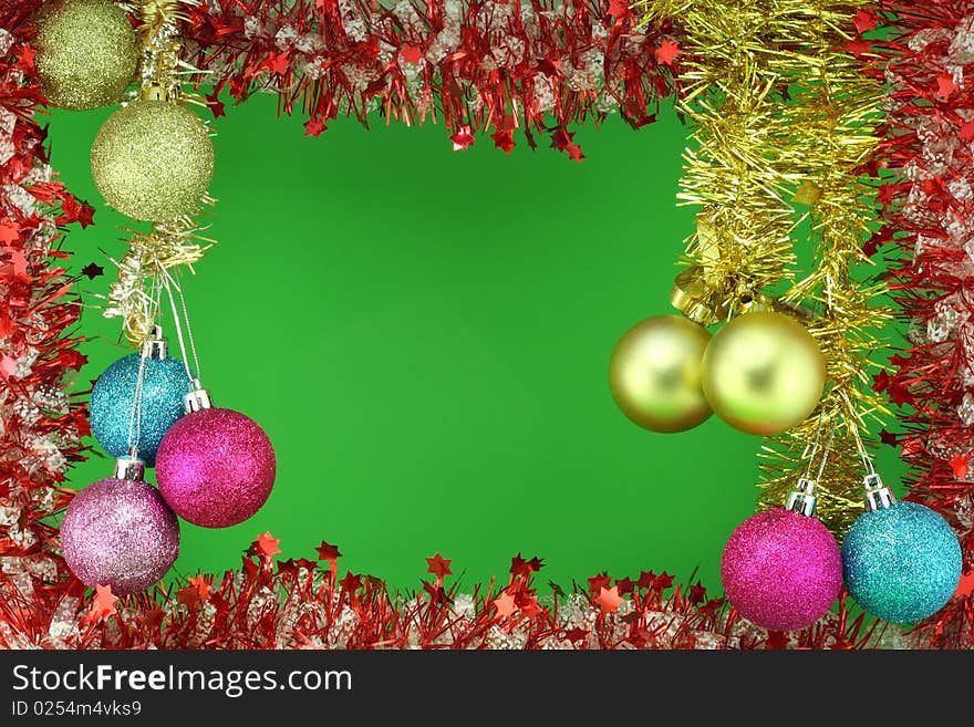 Bright New Year's garland, Christmas bouquet, green background. Beautiful colour balls decorate a composition. Bright New Year's garland, Christmas bouquet, green background. Beautiful colour balls decorate a composition.