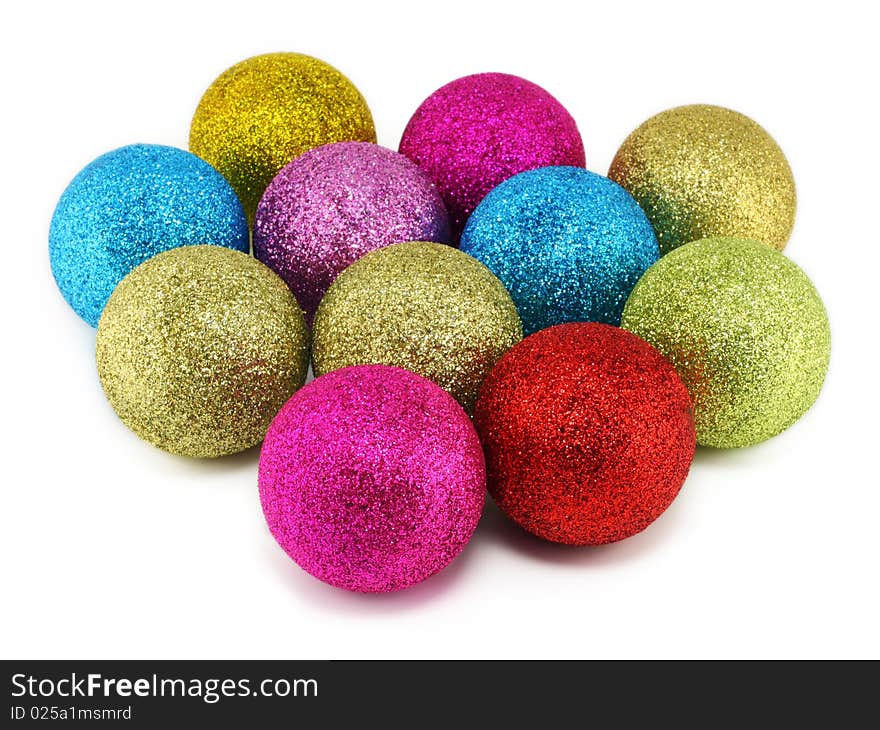 Gold, red, lilac and blue New Year's spheres with a rough surface. Isolated on white.