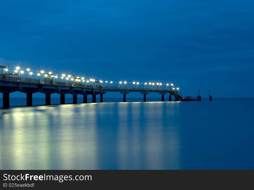 Lighted Polish pier at twilight. Lighted Polish pier at twilight