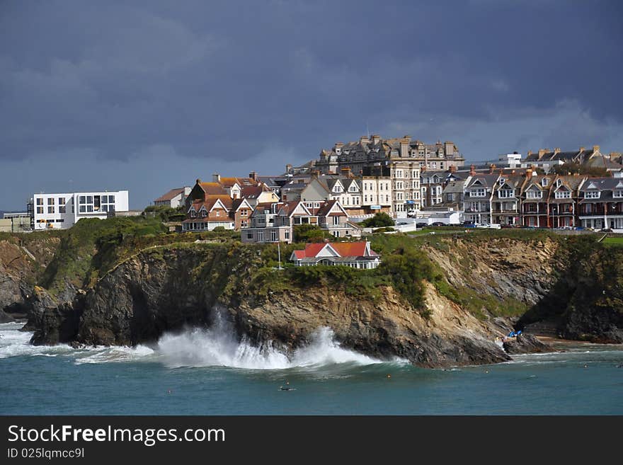 Dramatic stormy clouds in sky over bay with cliffs