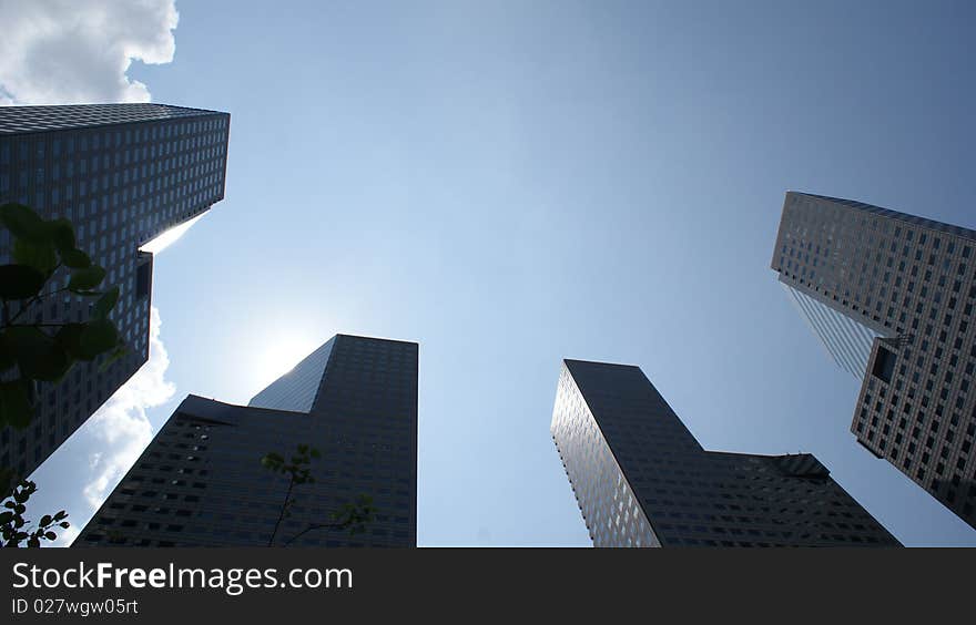 Peering into the sky between the Suntec Towers in Singapore. Peering into the sky between the Suntec Towers in Singapore