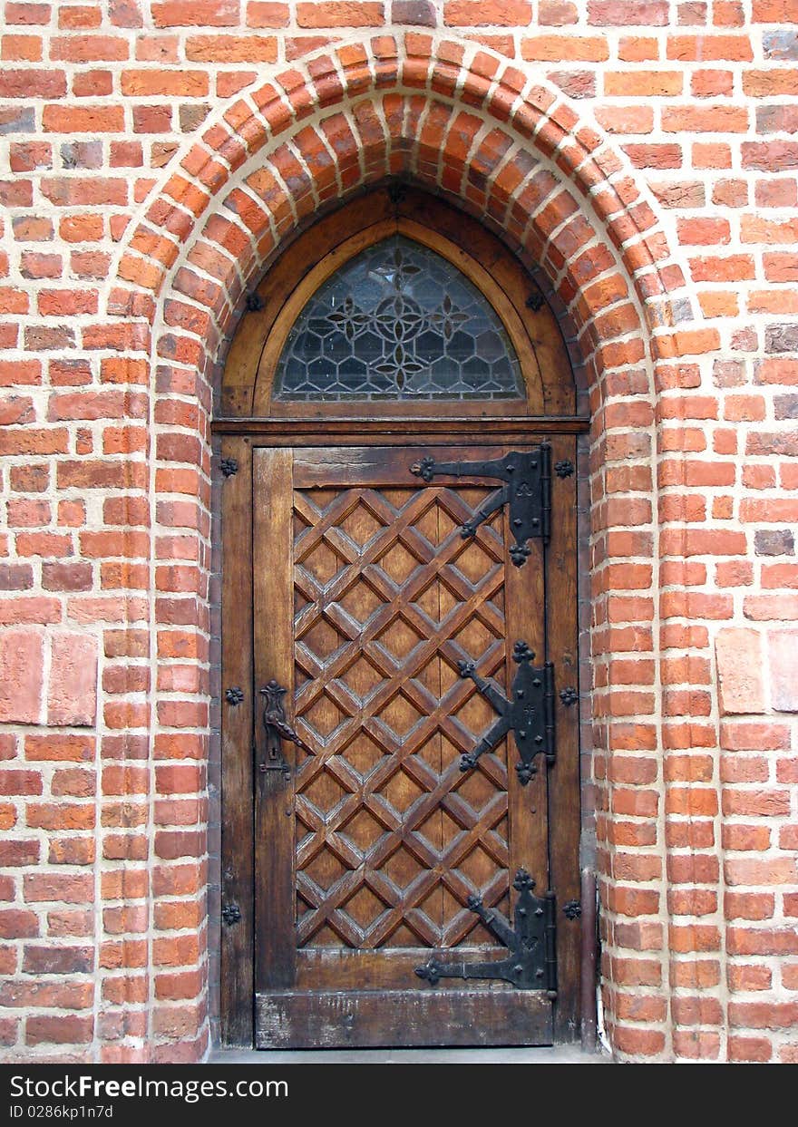 View on ghotic door in the brick wall