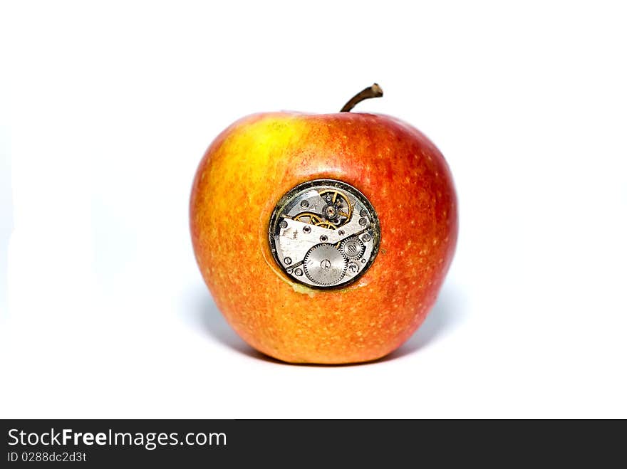 Apple with mechanisms inside on a white background. Apple with mechanisms inside on a white background