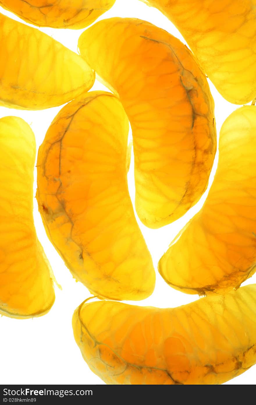 Transparent juicy sweet tasty segments of a tangerine. Isolated on white. Transparent juicy sweet tasty segments of a tangerine. Isolated on white