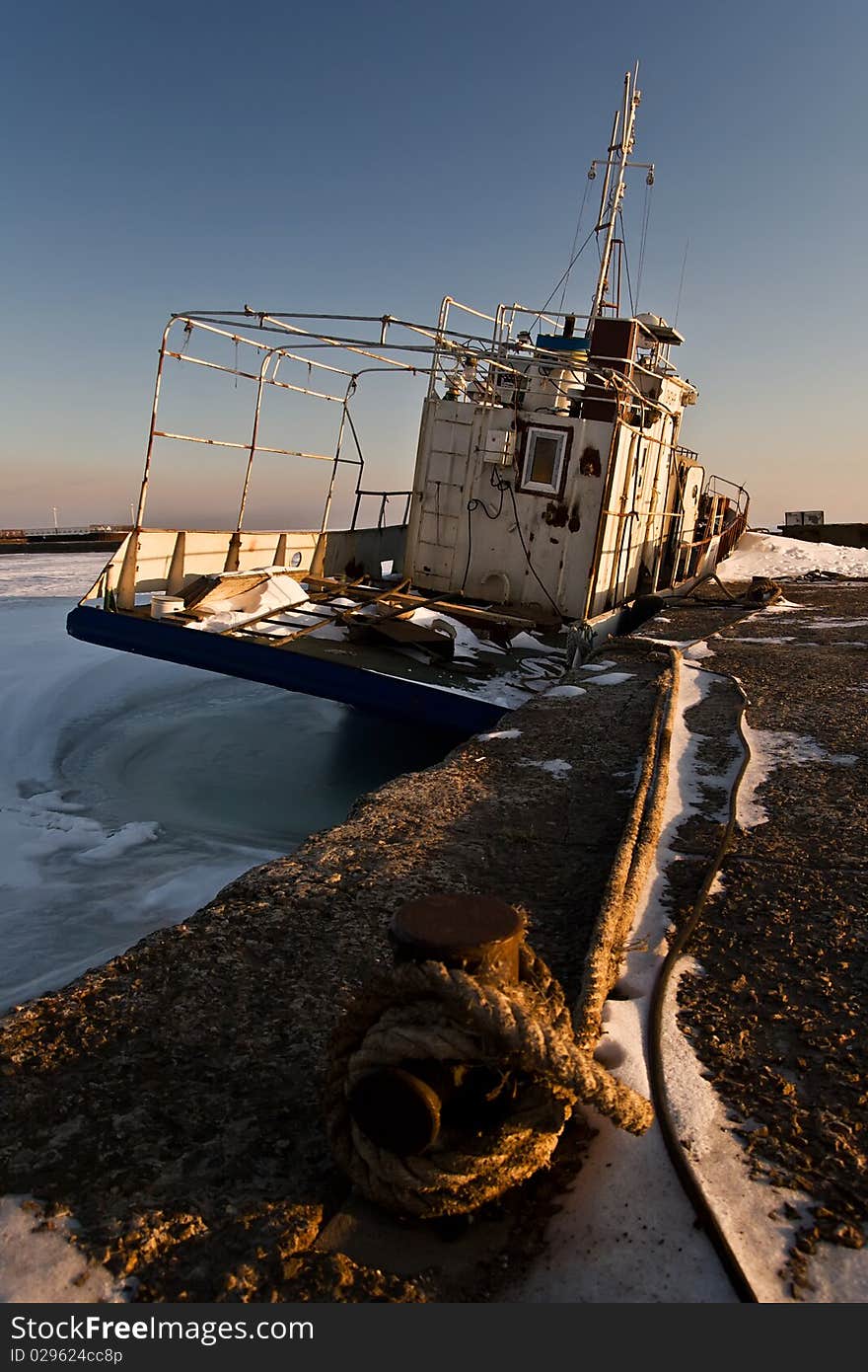 Ship in ice at the pier