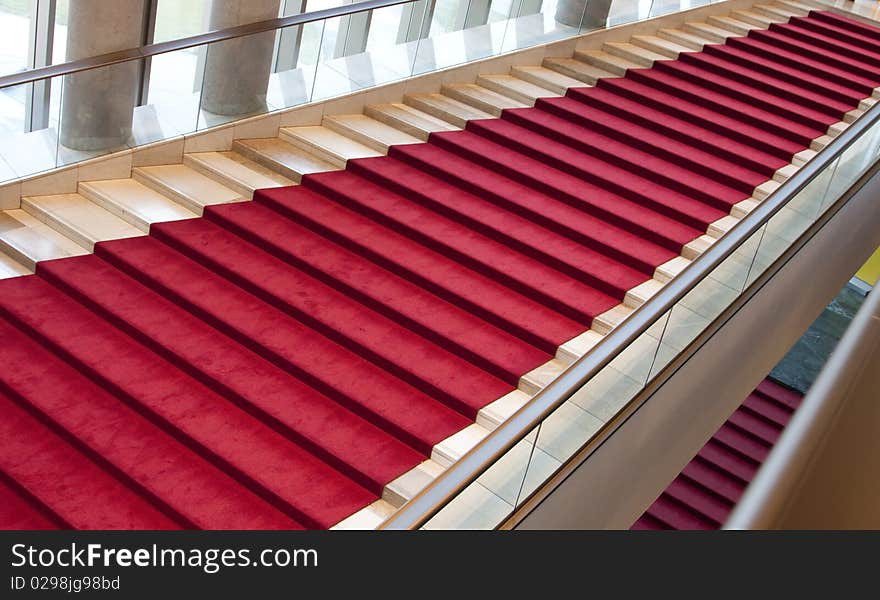 Stairs covered with red carpet