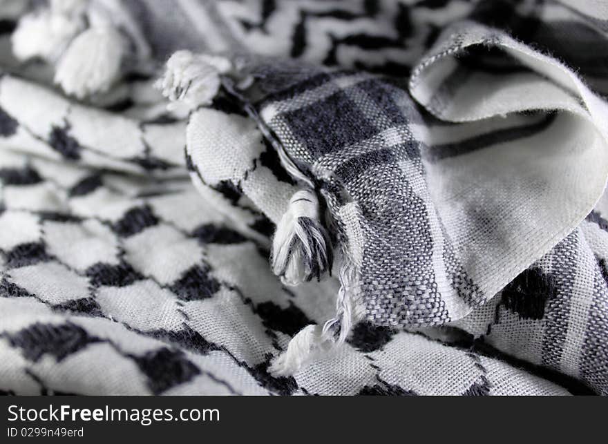 This is a photo of black and white arabic scarf. This is a photo of black and white arabic scarf