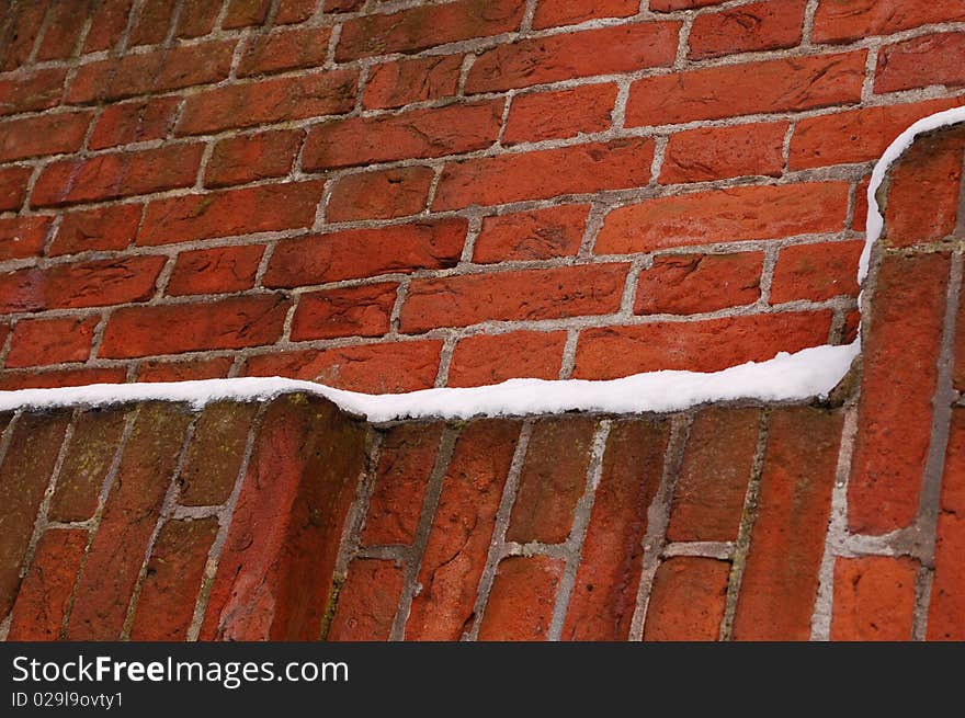 Brick Wall With  Stones And Snow