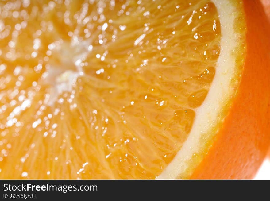 Juicy orange slice very close-up