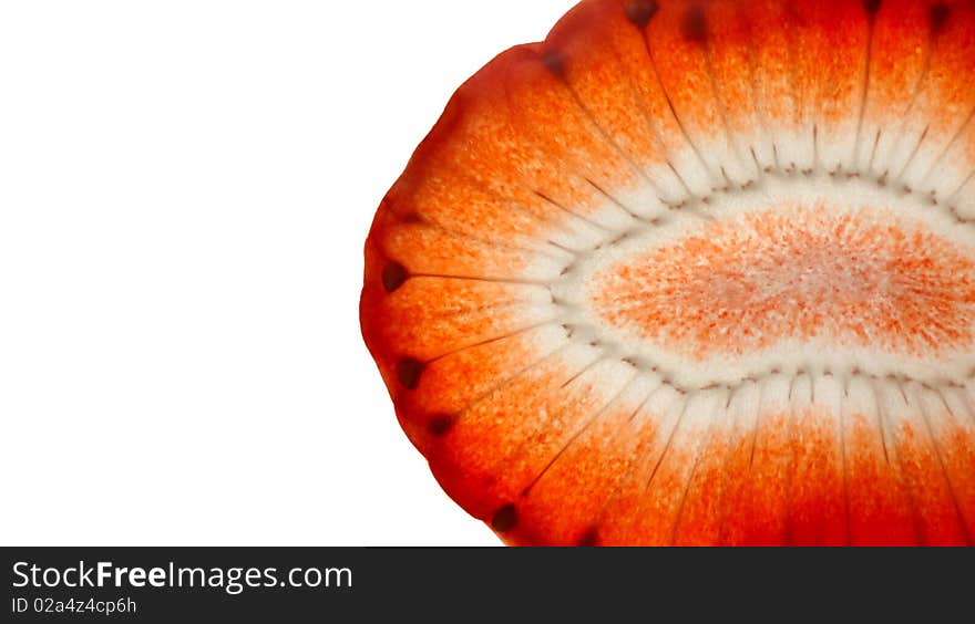 Strawberry slice isolated on bright white background, vibrant colours and see through texture. Strawberry slice isolated on bright white background, vibrant colours and see through texture