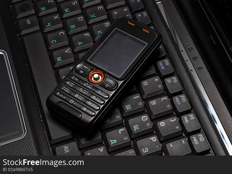 Mobile Phone On A Laptop