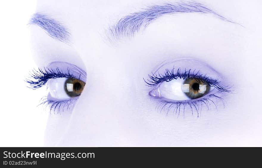 Brown female eyes in high key and light blue sepia