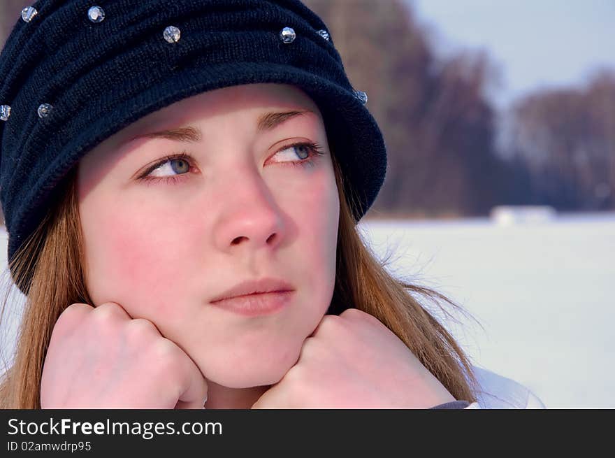 The young girl looks thoughtfully far. The young girl looks thoughtfully far