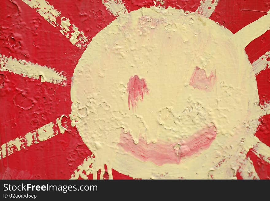 Painted sun in red and yellou