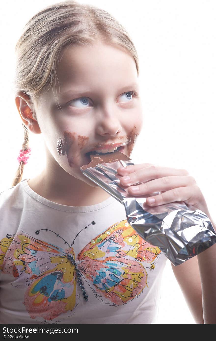 Little girl with chocolate on isolated white background