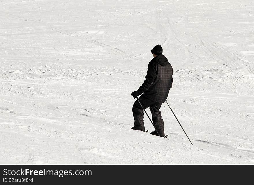 Skier in the snow seen from behind. Skier in the snow seen from behind