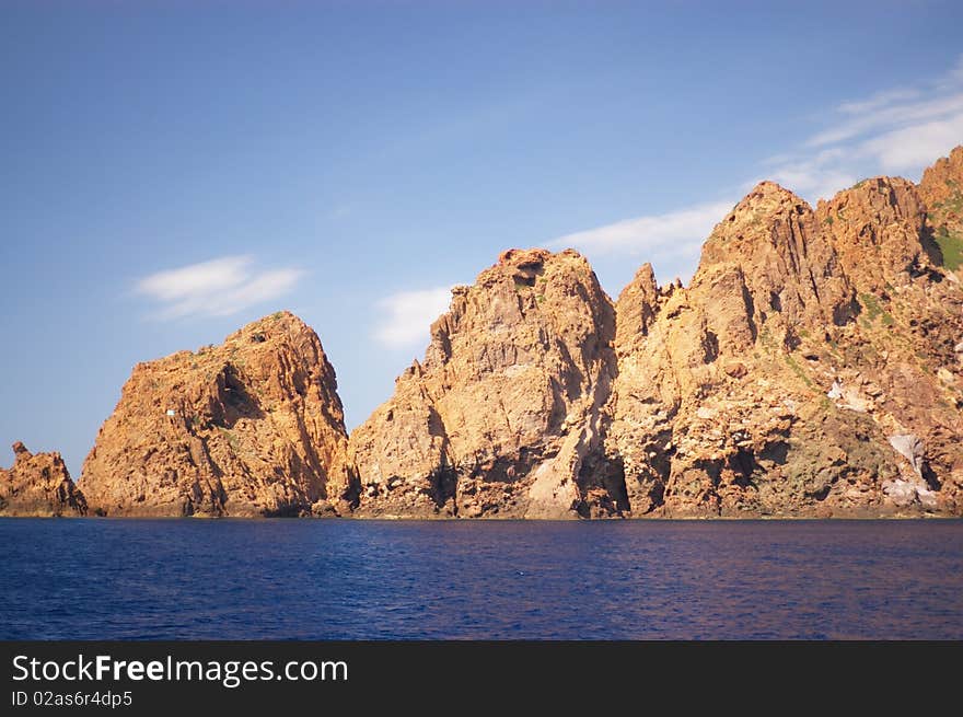 The nature reserve of Scandola peninsula in Corsica, France, Europe (listed in the World Heritage places in the world), vertical. The nature reserve of Scandola peninsula in Corsica, France, Europe (listed in the World Heritage places in the world), vertical