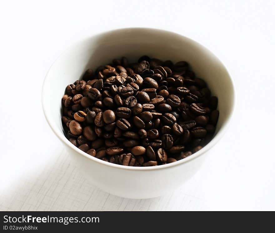 Macro shot of coffee beans in a cup