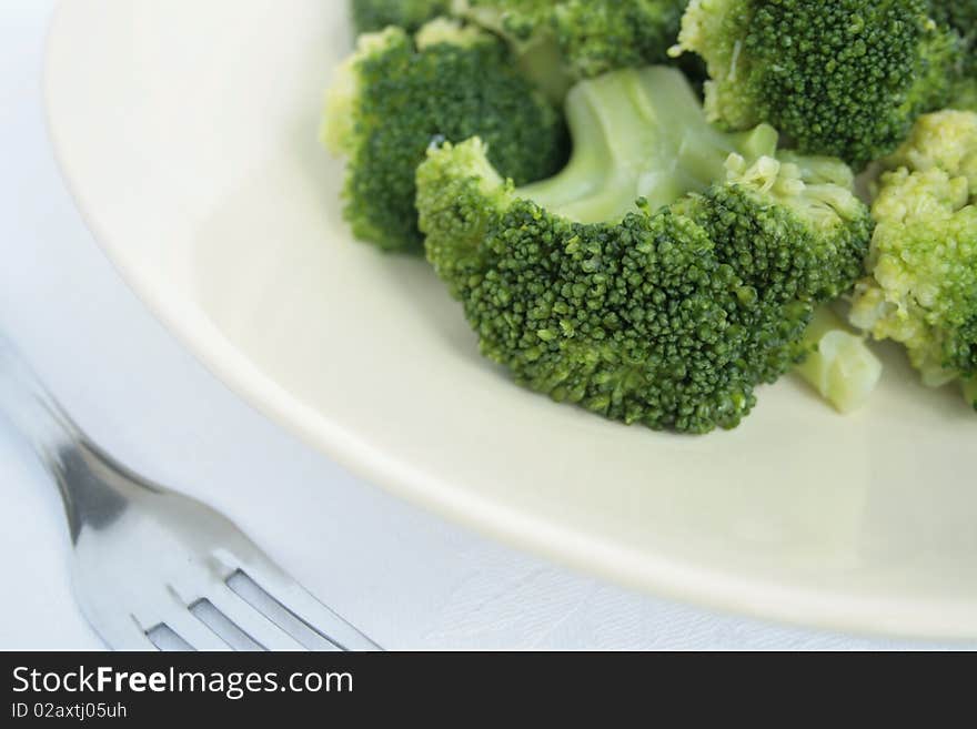 Healthy food on plate and fork.