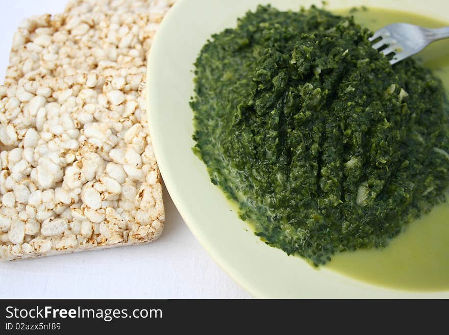 Spinach food on plate with rice.