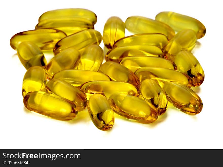 Golden capsules of a pill with medicinal oil. Golden capsules of a pill with medicinal oil.