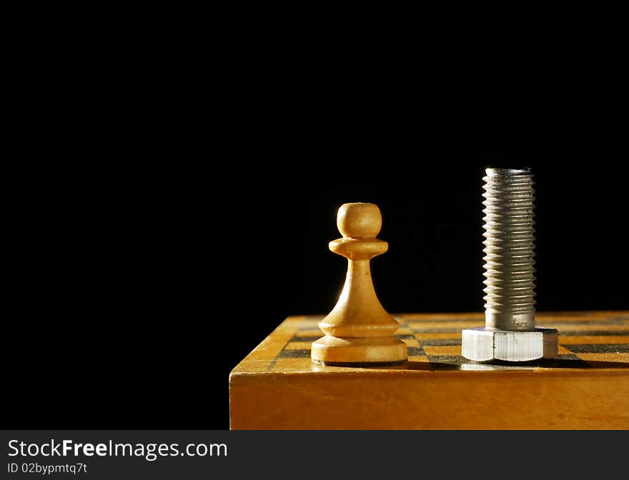 Chess figure and a bolt against black background. Chess figure and a bolt against black background