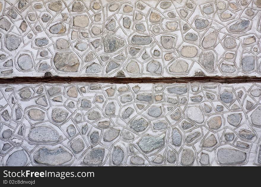 Mosaic stone wall texture background in traditional rural style. Mosaic stone wall texture background in traditional rural style