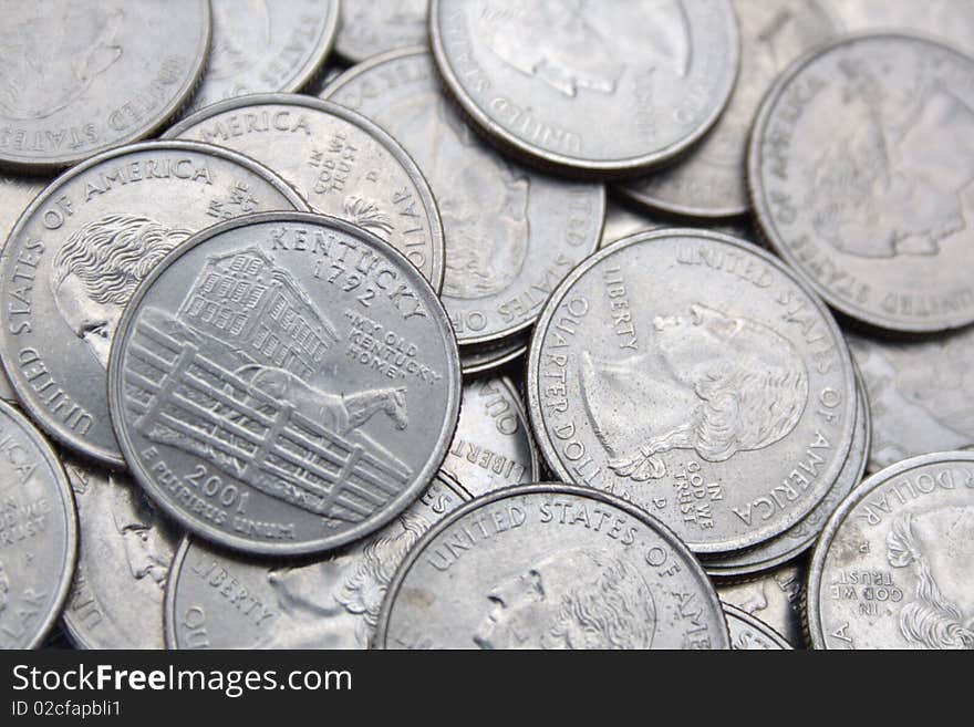 Coins pile with states anniversary mintage. Coins pile with states anniversary mintage.