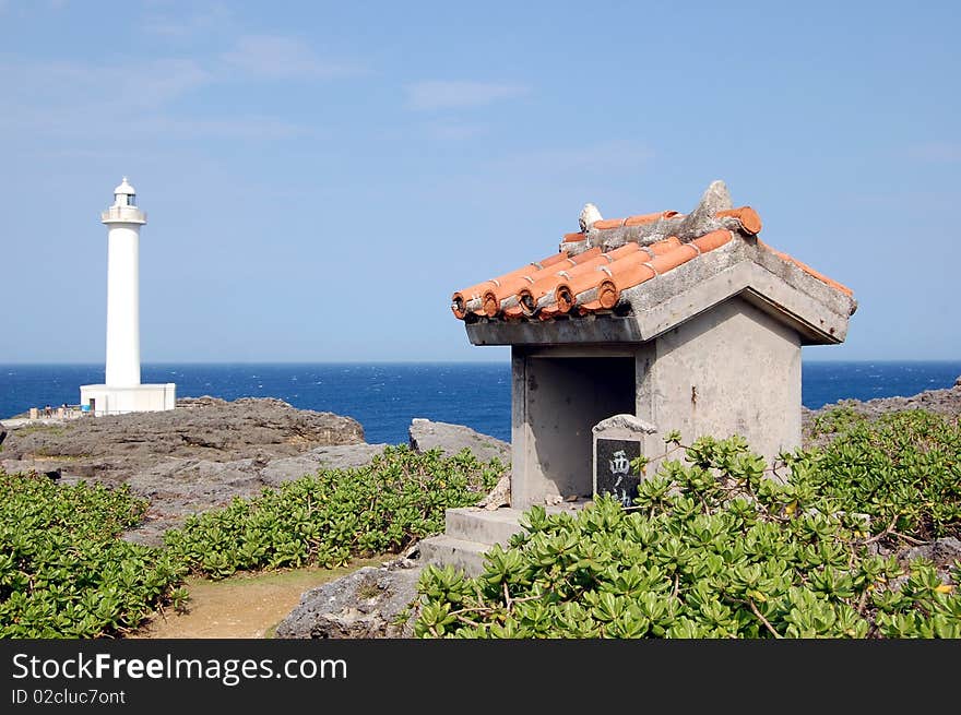 Small Shrine with Light House and Ocean in the Back Ground at Camp Zampa Okinawa Japan