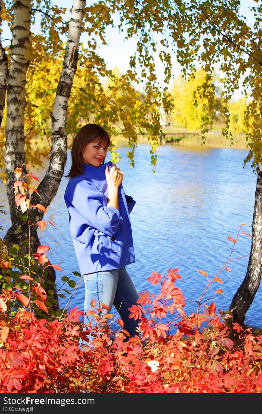 Girl on the background of the autumn landscape. Girl on the background of the autumn landscape