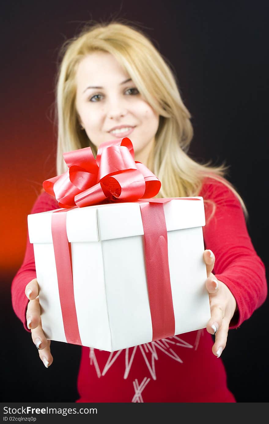 Woman with gift box in her hands. Woman with gift box in her hands